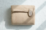 Tiramisu striped pet bath robe folded flat showing velcro strap