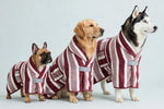 Three dogs wearing the red striped pet bath robe in sizes S, M and L