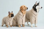 Three dogs wearing the tiramisu striped pet bath robe in sizes S, M and L